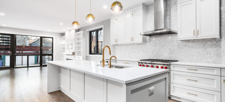 Beautiful modern white kitchen, with luxury vinyl flooring.