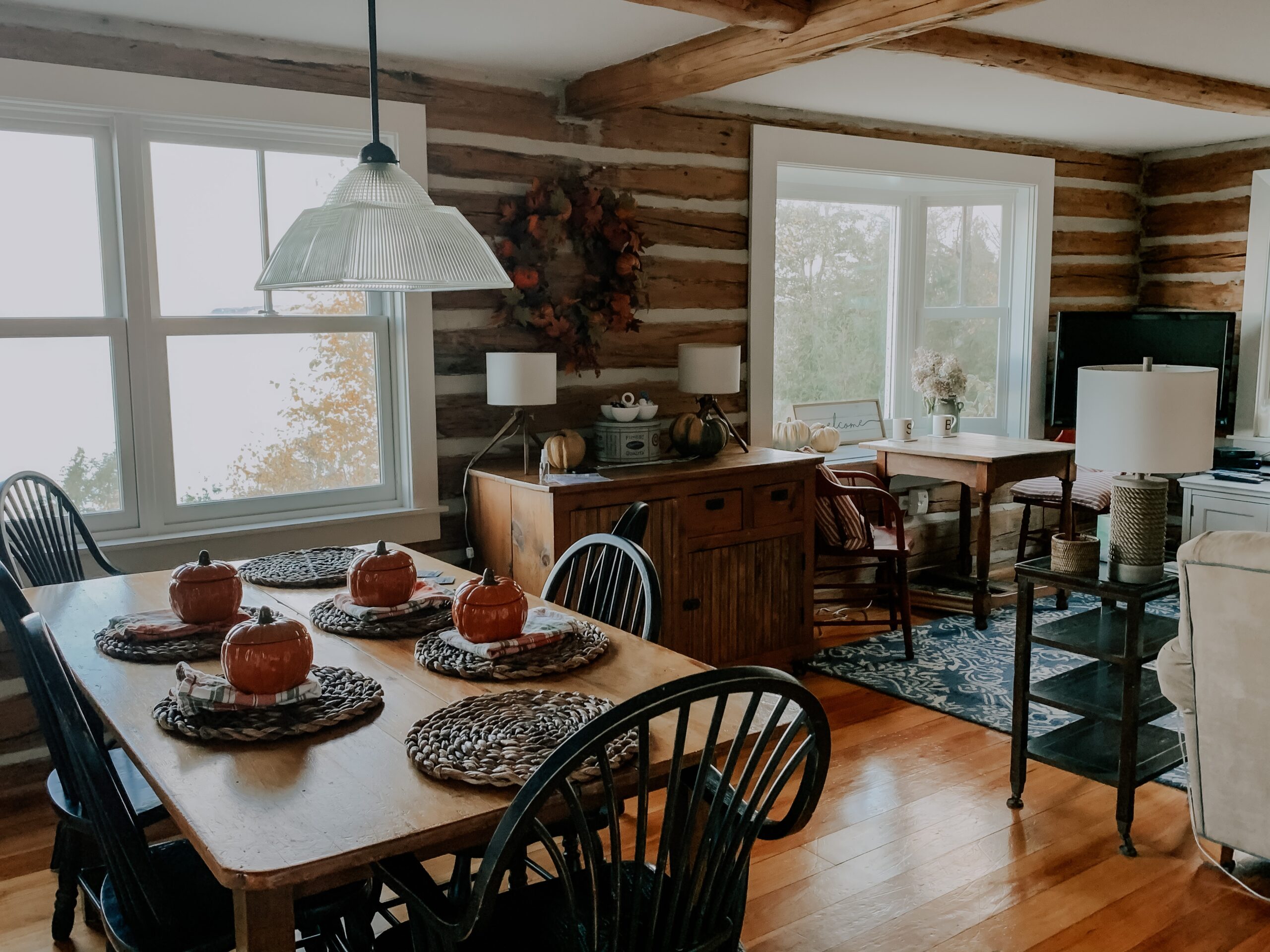Cute fall dining room with hardwood flooring